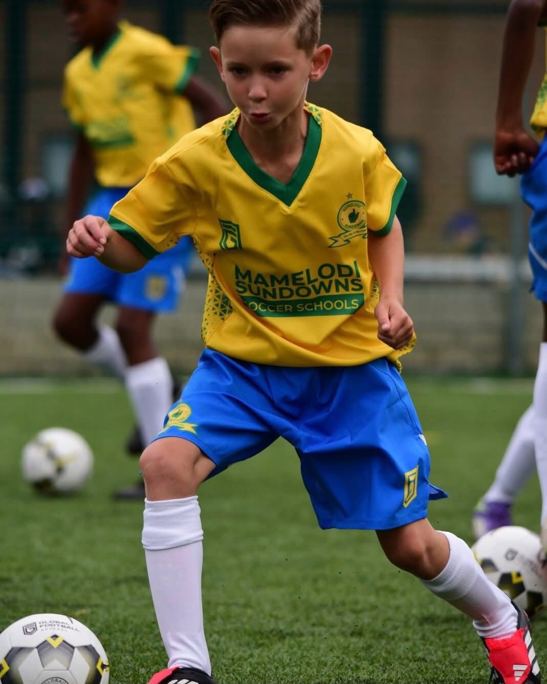 Young Sundowns player dribbling the ball